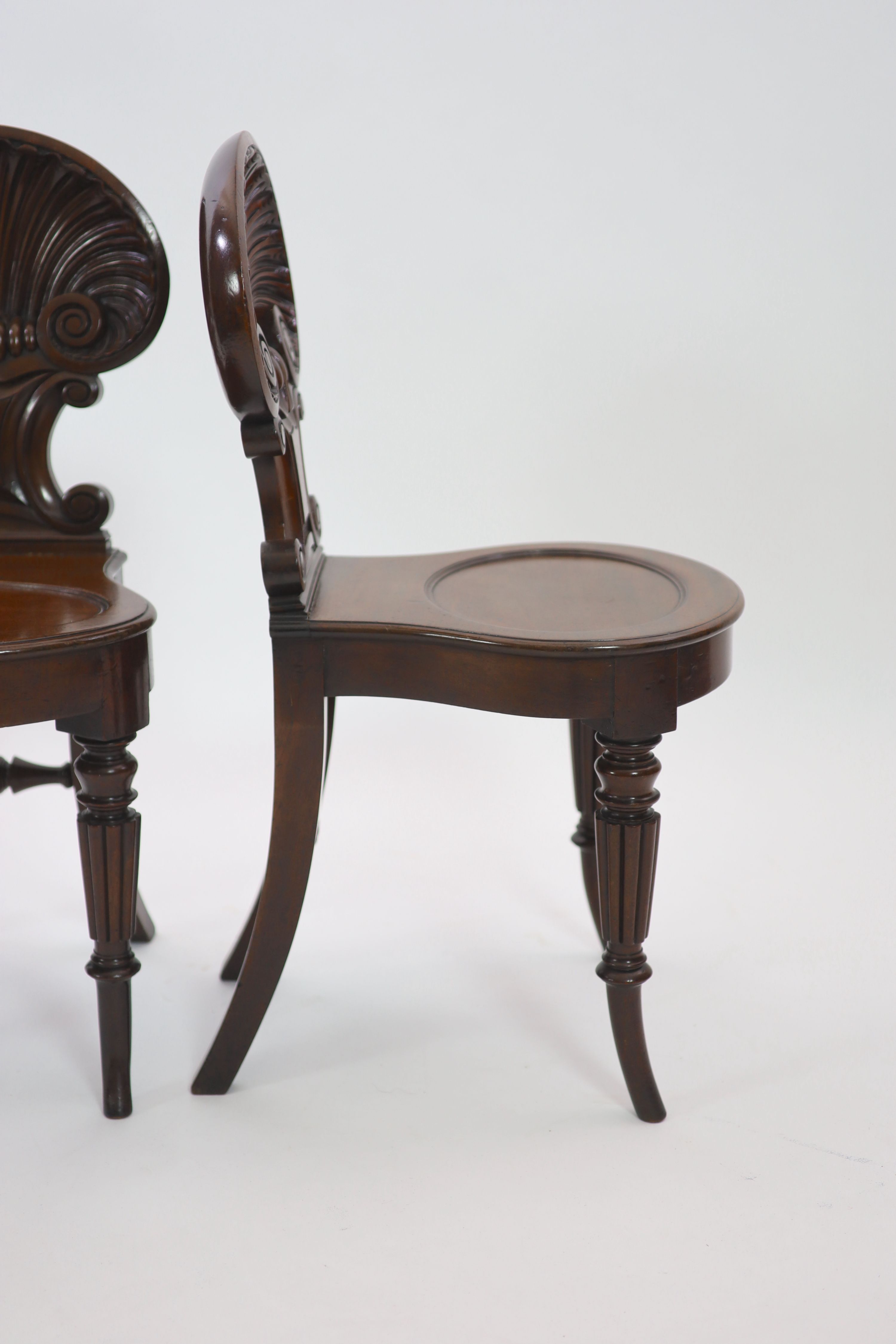 A pair of Regency mahogany hall chairs, attributed to Gillows, W.43cm H.87cm